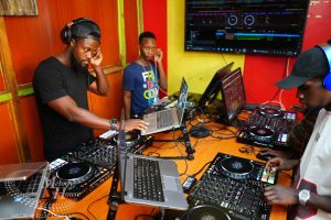 A collaborative DJ session at Music And Film Academy Nairobi, where multiple students practice mixing Arbantone and 3-Step Amapiano tracks on Pioneer DJ hardware.