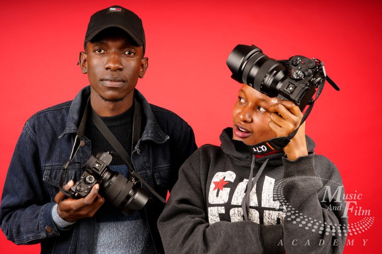 Videography student at Music and Film Academy Nairobi practicing cinematic camera movements with professional gear.