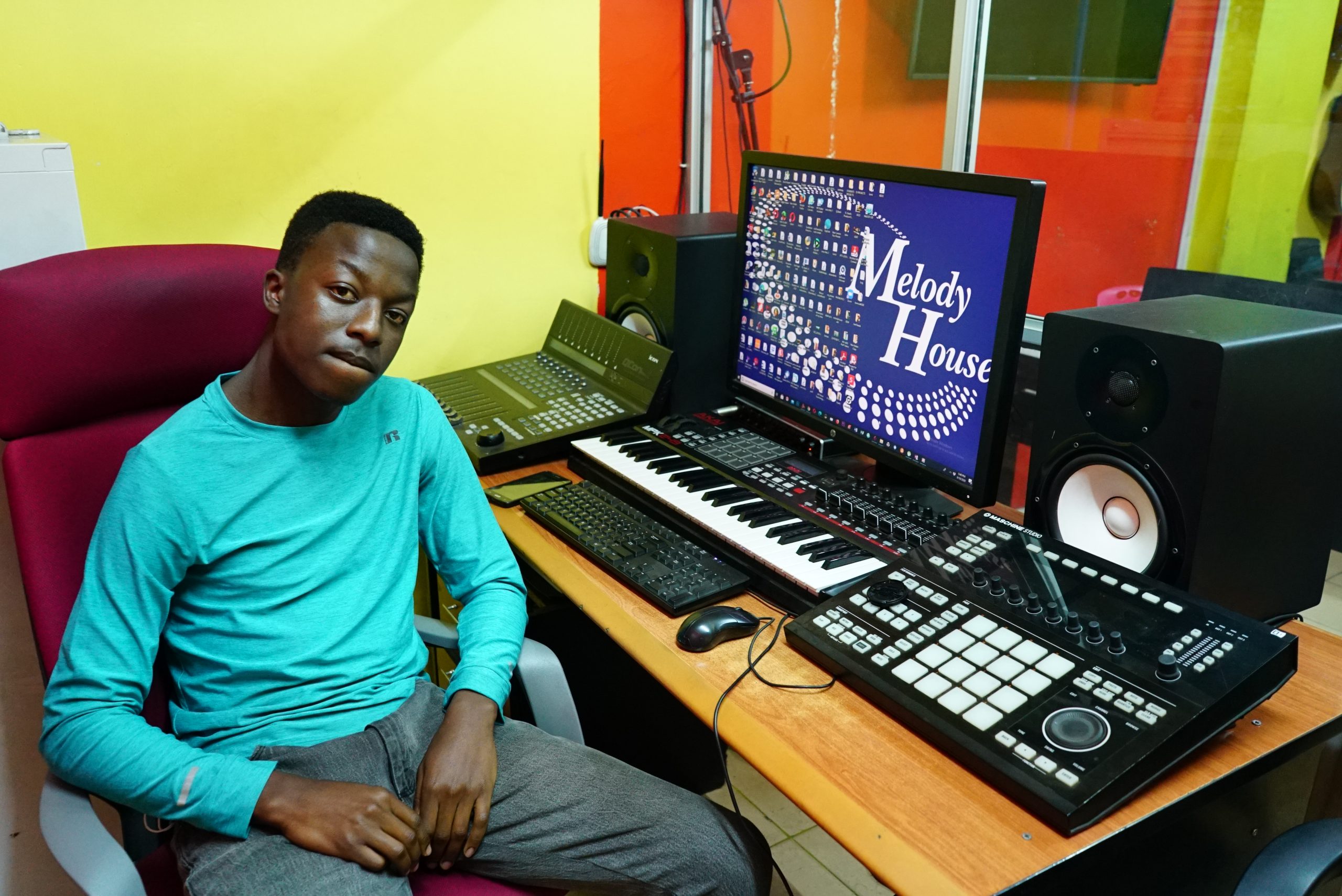 A side-angle view of Yamaha HS8 studio monitors and an Akai MPK249 MIDI controller at a student workstation in the Music And Film Academy Nairobi.