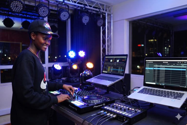 A student at the Music And Film Academy Nairobi utilizing SoundSwitch and DMX to create a synchronized, beat-synced light show in a professional studio environment