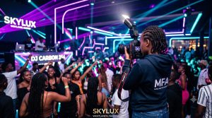 A photographer demonstrating how to shoot nightclub and event photography in Westlands using gear from the Music And Film Academy.